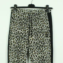 Laden Sie das Bild in den Galerie-Viewer, Second Hand PUMA x CHARLOTTE OLYMPIA Sweatpant Gr. XS schwarz creme Animalprint  (*)