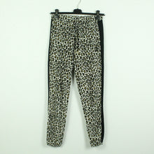 Laden Sie das Bild in den Galerie-Viewer, Second Hand PUMA x CHARLOTTE OLYMPIA Sweatpant Gr. XS schwarz creme Animalprint  (*)
